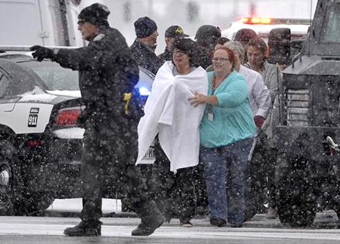 Victims of the terror at a Planned Parenthood clinic are led past police lines