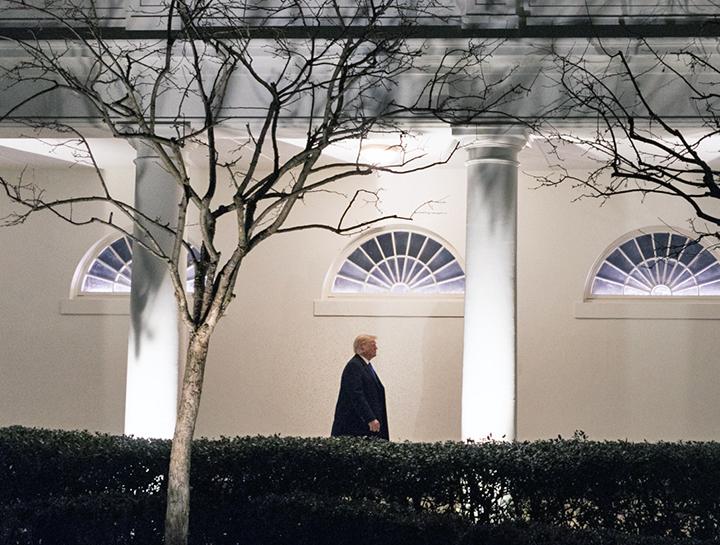 Donald Trump walks down the West Colonnade of the White House