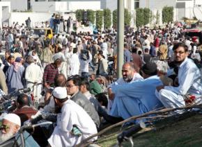 KESC workers and supporters camped out on the road in front of the company's headquarters