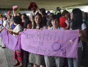 Protesters gather outside the Rio+20 conference