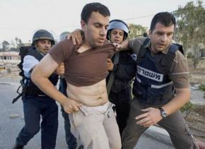 Israeli police arrest a Palestinian protesting against IDF violence