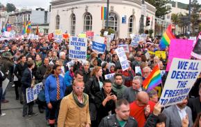 Protesters fill the streets of the Castro in San Francisco during a national day of action urging the Supreme Court to overturn DOMA and Prop 8