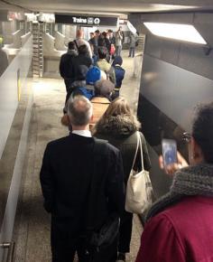 Ventra delays create a long line of commuters at a Chicago transit station
