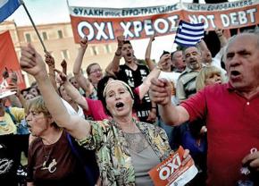 Athens residents celebrate the "no" vote against austerity in front of Greece's parliament