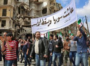Syrian protesters march against the Assad regime near Aleppo