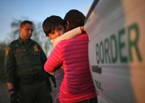 The U.S. Border Patrol detains a migrant mother and child