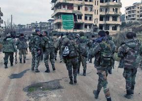 Syrian soldiers march into a conquered city