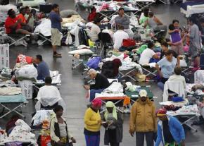 Victims of Hurricane Harvey seek shelter in a Houston convention center