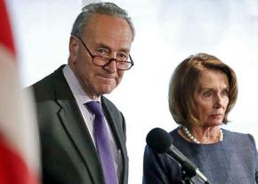 Democratic congressional leaders Chuck Schumer (left) and Nancy Pelosi speak to reporters