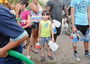 Families line up for water in Puerto Rico
