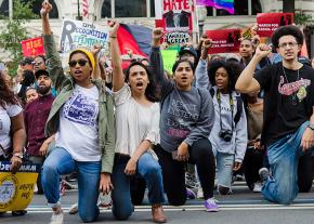 Protesters take a knee at the March for Racial Justice in Washington, D.C.