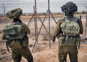 IDF soldiers patrol the borders of Gaza near the Kerem Shalom crossing