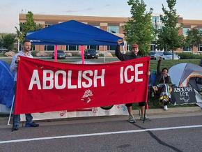 Activists protest outside an ICE field office in Centennial, Colorado