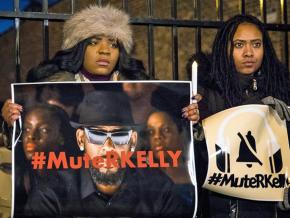 Protesters stand against sexual violence outside R. Kelly’s studio in Chicago
